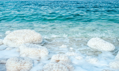 .incredibly beautiful seaside of the dead sea with blue water and white crystals of salt near.selective focus - 258897424