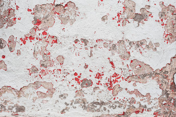 Wall fragment with scratches and cracks