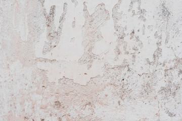 Wall fragment with scratches and cracks
