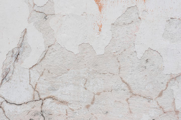 Wall fragment with scratches and cracks