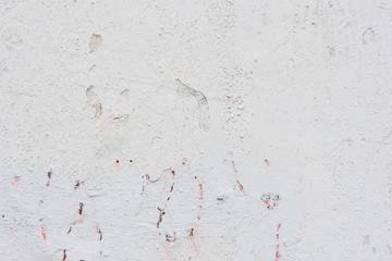 Wall fragment with scratches and cracks