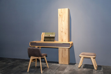 modern wooden workplace with console table on grey wall background