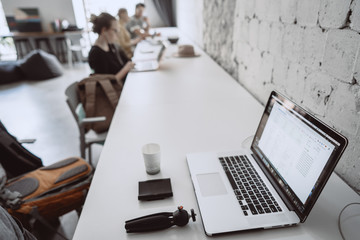 Empty workplace with different objects, a man moved away