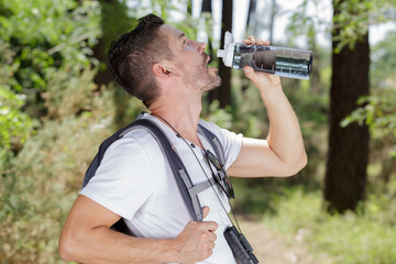 photo of a man drinking water