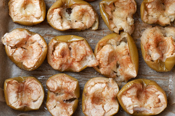 Flat-lay of baked apples. baked halves of apples with honey, cinnamon . top view 