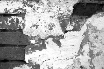 Old grungy brick wall texture in black and white.