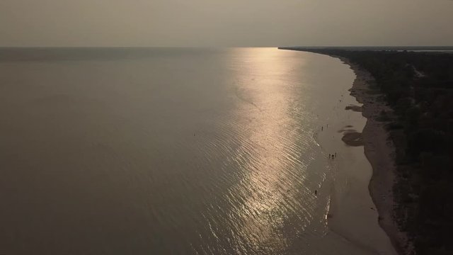 Lake Erieat night, beach and turbid water after storm. Aerial view. 4k.
