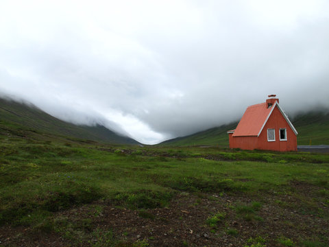 Scenic of Icelandic old house in a valley in eastern Iceland in a cloudy day