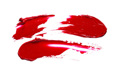 Red lipstick or acrylic paint isolated on white