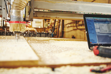 CNC router machine creates a layout of the shelf complex.