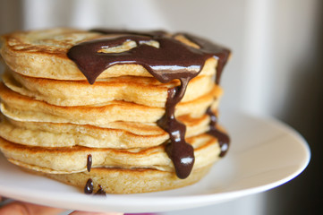 Breakfast, homemade classic american pancakes with chocolate syrup
