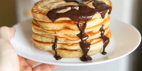 Breakfast, homemade classic american pancakes with chocolate syrup