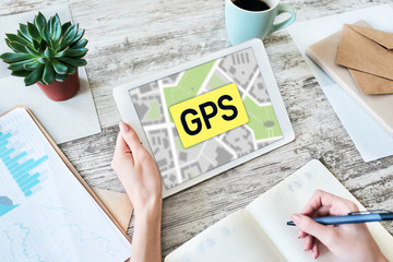 GPS Global Positioning System, Worldwide navigation and tracking concept with town maps on screen.