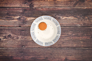 Cookies in plate on wooden background