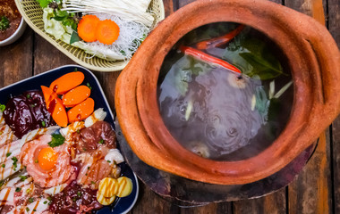 Delicious Shabu hot pot meat, pork seafood and vegetable on table.Top view