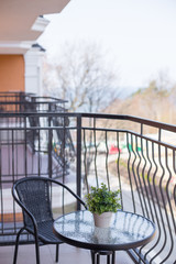 balcony with wrought-iron furniture in the apartment
