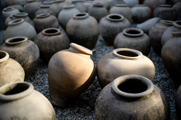 Fototapeta na wymiar old pottery pot in yard