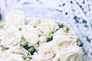 Bouquet of white roses and wedding attributes. Wedding background