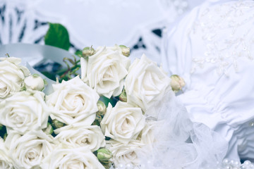 Bouquet of white roses and wedding attributes. Wedding background