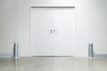 Double doors with security lock  in warehouse close up.