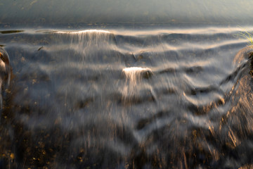 Background of wavy surface of mild water flowing from floodgate. (1)