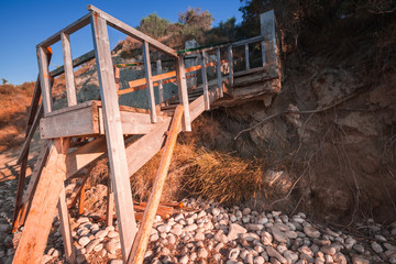 Old wooden stairs going to the beach