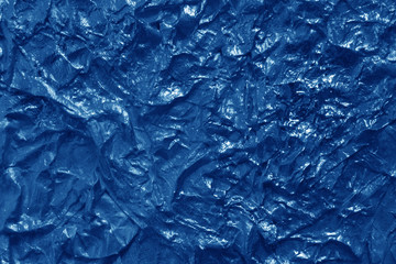 Metal foil texture in navy blue color.