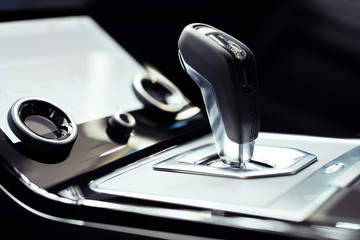 Fototapeta na wymiar Close-up on automatic transmission lever in modern car