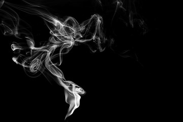 white smoke flame on a black background