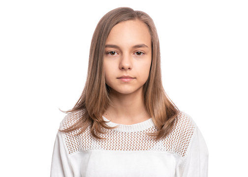 Beautiful caucasian Teen Girl isolated on white background. Schoolgirl looking at camera. Happy child - close-up portrait.