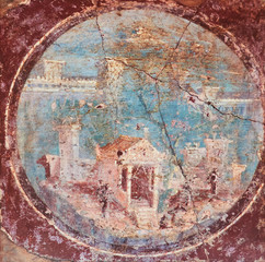 ancient Roman villa in fresco on a red background in a Domus of Pompeii