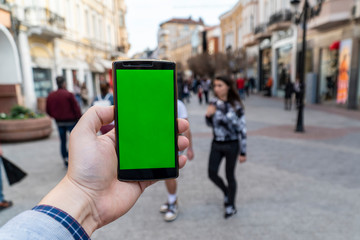 Using a phone on the street concept