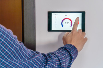 Smart home climate control device on a wall