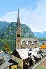 View of Hallstatt village from lake Hallstater See in Alps. Austria. Popular tourist destination.