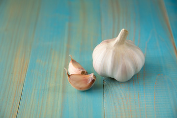 Garlic bulb on the wooden vintage background