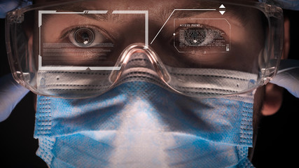Doctor being futuristic vision with future technology glasses in hologram. immersive technology, futuristic vision and protection and security of persons. Concept of: Formula, New technology, Future.