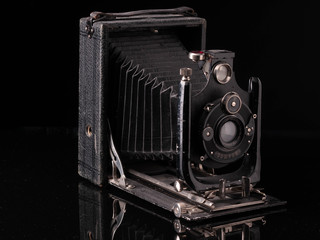 vintage compur camera 1939 year release with reflection on black background