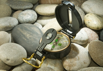 compass on stones closeup