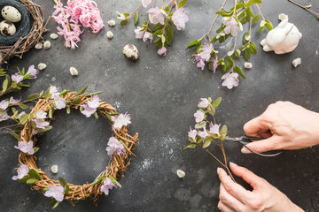 Spring wreath with flowers. Creative flat lay. View from above.