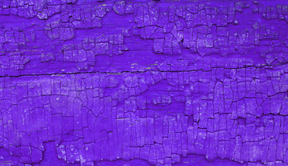 Old wooden background with remains of pieces of scraps of old paint on wood. Texture of an old tree, vintage wood background peeling paint. old blue board with cracked paint