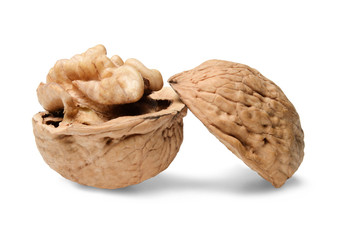 Chopped walnut on white isolated background. Close-up. Macro. Side view.