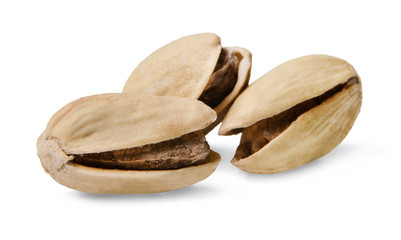 A few pistachios on a white isolated background. Close-up. Macro. Side view.