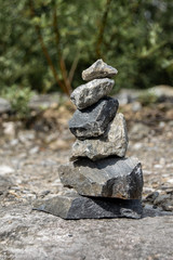 A stone pyramid in a marble canyon.