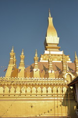 Fototapeta premium Vientiane Laos -, 1 Apr. 2019; Pha That Luang (Gold Stupa) or “Great Stupa” was built in 1566 after King Setthathirath had made Vientiane the new capital of the Lan Xang Kingdom.