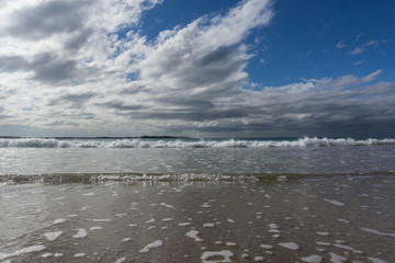 waves in the ocean and blue sky