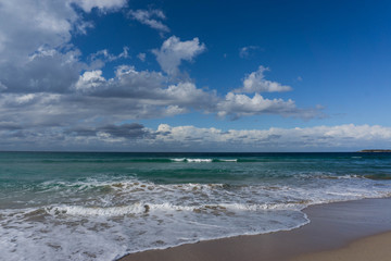 waves in the ocean and blue sky