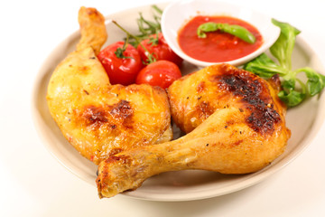 grilled chicken leg and tomato sauce isolated on white background