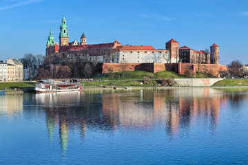 Wawel Hill with Wawel Royal Castle and Wawel Cathedral in Krakow, Poland. View from Debnicki bridge across Vistula river.