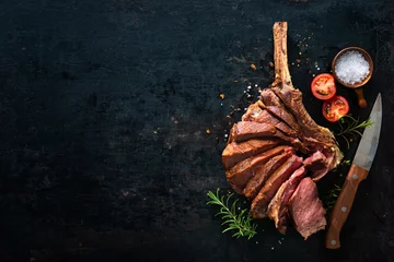  Grilled dry aged tomahawk steak sliced as close-up © Alexander Raths