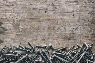 Assorted threaded screws forming a lower border